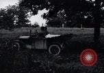 Image of camping in car United States USA, 1920, second 14 stock footage video 65675031931