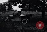 Image of camping in car United States USA, 1920, second 15 stock footage video 65675031931