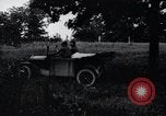 Image of camping in car United States USA, 1920, second 16 stock footage video 65675031931