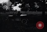 Image of camping in car United States USA, 1920, second 17 stock footage video 65675031931