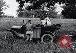 Image of camping in car United States USA, 1920, second 20 stock footage video 65675031931