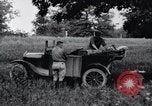 Image of camping in car United States USA, 1920, second 21 stock footage video 65675031931