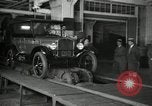 Image of Workers with Model T Fifteen Millionth car Highland Park Michigan USA, 1927, second 8 stock footage video 65675031962