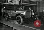 Image of Workers with Model T Fifteen Millionth car Highland Park Michigan USA, 1927, second 12 stock footage video 65675031962