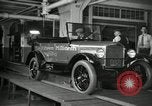 Image of Workers with Model T Fifteen Millionth car Highland Park Michigan USA, 1927, second 21 stock footage video 65675031962