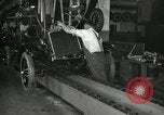 Image of Workers with Model T Fifteen Millionth car Highland Park Michigan USA, 1927, second 52 stock footage video 65675031962