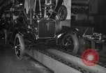 Image of Workers with Model T Fifteen Millionth car Highland Park Michigan USA, 1927, second 60 stock footage video 65675031962