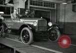 Image of Edsel Ford with Model T Fifteen Millionth car Highland Park Michigan USA, 1927, second 60 stock footage video 65675031963