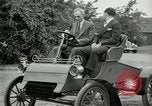 Standbild Henry Ford und Sohn Edsel Ford pose in frühen Modell Autos Dearborn Michigan USA, 1933, aus Sekunde 34 historischem Filmmaterial Videoclip 65675032016