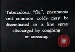 Image of disease causing bacteria sneezing or coughing United States USA, 1922, second 4 stock footage video 65675032296