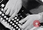 Image of hands performing various jobs late 1930s United States USA, 1937, second 3 stock footage video 65675032298