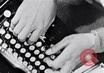 Image of hands performing various jobs late 1930s United States USA, 1937, second 4 stock footage video 65675032298