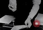 Image of hands performing various jobs late 1930s United States USA, 1937, second 23 stock footage video 65675032298