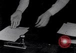 Image of hands performing various jobs late 1930s United States USA, 1937, second 24 stock footage video 65675032298