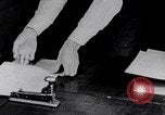 Image of hands performing various jobs late 1930s United States USA, 1937, second 25 stock footage video 65675032298