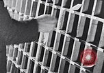 Image of hands performing various jobs late 1930s United States USA, 1937, second 28 stock footage video 65675032298