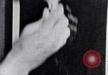Image of hands performing various jobs late 1930s United States USA, 1937, second 60 stock footage video 65675032298