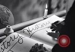 Image of large volume titled history on desk United States USA, 1951, second 18 stock footage video 65675032397