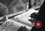 Image of large volume titled history on desk United States USA, 1951, second 19 stock footage video 65675032397