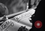 Image of large volume titled history on desk United States USA, 1951, second 30 stock footage video 65675032397