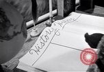 Image of large volume titled history on desk United States USA, 1951, second 46 stock footage video 65675032397