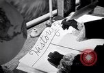 Image of large volume titled history on desk United States USA, 1951, second 53 stock footage video 65675032397