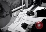 Image of large volume titled history on desk United States USA, 1951, second 57 stock footage video 65675032397