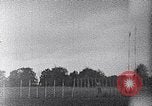 Standbild ein Mann lofted in der Luft von einem Flugzeug Thomasville Georgia United States USA, 1935, aus Sekunde 19 historischem Filmmaterial Videoclip 65675032574