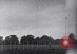 Standbild ein Mann lofted in der Luft von einem Flugzeug Thomasville Georgia United States USA, 1935, aus Sekunde 27 historischem Filmmaterial Videoclip 65675032574