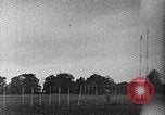 Standbild ein Mann lofted in der Luft von einem Flugzeug Thomasville Georgia United States USA, 1935, aus Sekunde 35 historischem Filmmaterial Videoclip 65675032574
