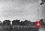 Standbild ein Mann lofted in der Luft von einem Flugzeug Thomasville Georgia United States USA, 1935, aus Sekunde 44 historischem Filmmaterial Videoclip 65675032574