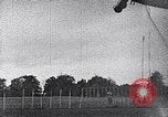 Standbild ein Mann lofted in der Luft von einem Flugzeug Thomasville Georgia United States USA, 1935, aus Sekunde 46 historischem Filmmaterial Videoclip 65675032574