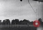 Standbild ein Mann lofted in der Luft von einem Flugzeug Thomasville Georgia United States USA, 1935, aus Sekunde 48 historischem Filmmaterial Videoclip 65675032574