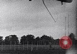 Standbild ein Mann lofted in der Luft von einem Flugzeug Thomasville Georgia United States USA, 1935, aus Sekunde 49 historischem Filmmaterial Videoclip 65675032574