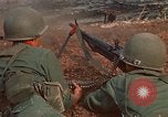 Image of RF-PF forces with M-60 machine gun and M-79 Grenade Launcher Vietnam, 1970, second 21 stock footage video 65675032682