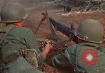 Image of RF-PF forces with M-60 machine gun and M-79 Grenade Launcher Vietnam, 1970, second 24 stock footage video 65675032682