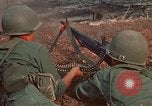 Image of RF-PF forces with M-60 machine gun and M-79 Grenade Launcher Vietnam, 1970, second 25 stock footage video 65675032682