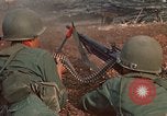 Image of RF-PF forces with M-60 machine gun and M-79 Grenade Launcher Vietnam, 1970, second 26 stock footage video 65675032682