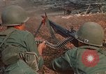 Image of RF-PF forces with M-60 machine gun and M-79 Grenade Launcher Vietnam, 1970, second 27 stock footage video 65675032682