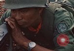 Image of RF-PF forces with M-60 machine gun and M-79 Grenade Launcher Vietnam, 1970, second 40 stock footage video 65675032682