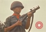 Image of RF-PF forces with M-60 machine gun and M-79 Grenade Launcher Vietnam, 1970, second 42 stock footage video 65675032682