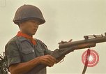 Image of RF-PF forces with M-60 machine gun and M-79 Grenade Launcher Vietnam, 1970, second 46 stock footage video 65675032682