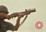 Image of RF-PF forces with M-60 machine gun and M-79 Grenade Launcher Vietnam, 1970, second 49 stock footage video 65675032682