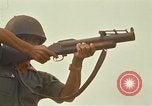 Image of RF-PF forces with M-60 machine gun and M-79 Grenade Launcher Vietnam, 1970, second 52 stock footage video 65675032682