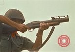 Image of RF-PF forces with M-60 machine gun and M-79 Grenade Launcher Vietnam, 1970, second 53 stock footage video 65675032682
