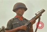 Image of RF-PF forces with M-60 machine gun and M-79 Grenade Launcher Vietnam, 1970, second 61 stock footage video 65675032682