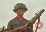 Image of RF-PF forces with M-60 machine gun and M-79 Grenade Launcher Vietnam, 1970, second 62 stock footage video 65675032682