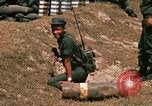 Image of Vietnamese Forces engaged in live fire mock combat Vietnam, 1970, second 61 stock footage video 65675032684