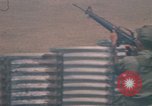 Image of Vietnamese forces firing M-16s in live fire exercise Vietnam, 1970, second 48 stock footage video 65675032685