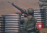 Image of Vietnamese forces firing M-16s in live fire exercise Vietnam, 1970, second 49 stock footage video 65675032685